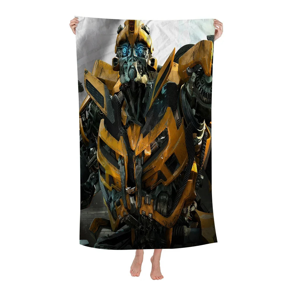 Couverture avec grand imprimé du robot Bumblebee jaune et noir sur fond gris – Transformers.