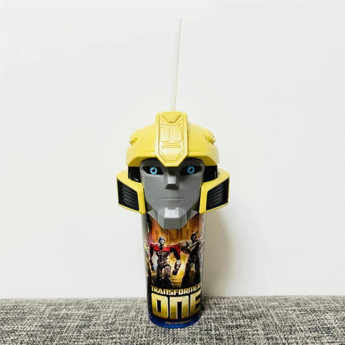 Gobelet Transformers One avec couvercle tête de robot jaune, personnages et logo en décor – Transformers.