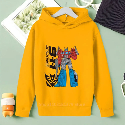 Sweat à capuche jaune avec robot Optimus Prime debout, décor stylisé, logo Autobots – Transformers.
