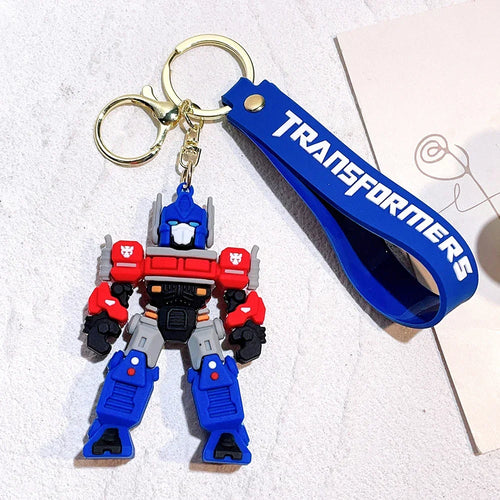 Porte-clés Optimus Prime coloré en plastique, avec lanière bleue TRANSFORMERS – Transformers.