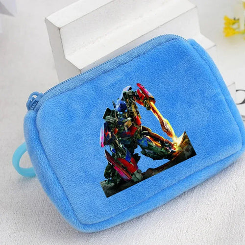 Trousse bleue en tissu avec robot Optimus Prime debout sur fond neutre – Transformers.