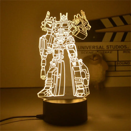 Veilleuse LED robot lumineux, silhouette stylisée posée sur une base noire, lumière jaune – Transformers.